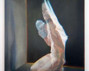 A semi-photorealistic painting of a naked woman kneeling on the ground, looking at a clear mask in her hands. She is looking at a grey wall, which projects her shadow. there is a black wall behind her, outlined in yellow/orange like a light is lit behind it.
