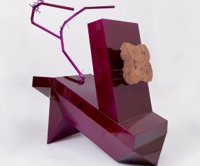 A large fuchsia sculpture made out of aluminum, with scorpion-like stinger and a face made of polished wood