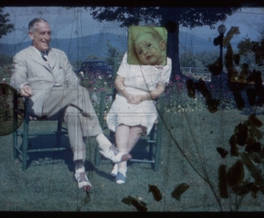 A film still, an elderly couple sitting in chairs on the grass with silhouettes of confetti on the film at right, and a baby image added on top of the female sitter's face