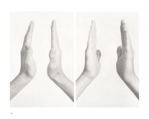 A black and white photograph of 2 sets of hands, open and pointing upwards, with space between them.