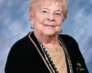 A photograph of an elderly white woman against a black background