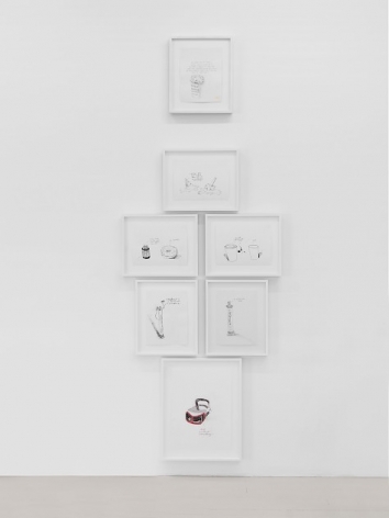 An installation of black-and-white drawings organized in a column on a white wall