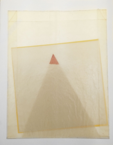 A triangle and square made of tracing paper, nestled inside a wax bag so you can see the silhouettes of the shapes