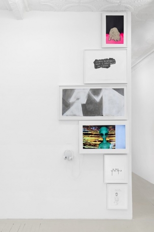 A column of drawings, paintings, and a video work, installed at the edge of a wall that leads into another room. All works are justified to the edge of the wall.