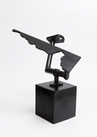 A bronze sculpture with a block base, and 2 arms made of bronze. One arm looks like a small paddle with a hole, the other looks like a custom piece of cut wood in an idiosyncratic form.