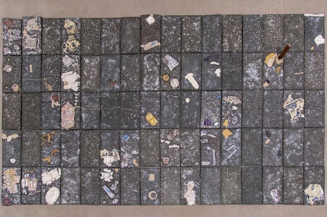 Aerial view of the large floor sculpture by Kahlil Robert Irving, made up of 80 black clay ceramic tiles with varied inserts and decals